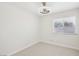 Bedroom features neutral tile floors, a modern ceiling fan and bright natural light at 7139 Mountain Moss Dr, Las Vegas, NV 89147