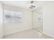 Bedroom features sliding closet door, a window, and neutral tile floors at 7139 Mountain Moss Dr, Las Vegas, NV 89147