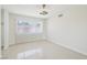 Bedroom with bright tile floors, and large window, offers natural light and comfort at 7139 Mountain Moss Dr, Las Vegas, NV 89147