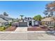 Well-maintained single-story home with a gray two-car garage and neutral-toned exterior for a welcoming curb appeal at 7139 Mountain Moss Dr, Las Vegas, NV 89147
