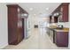 Bright kitchen with granite countertops, stainless appliances, and an open floor plan at 7139 Mountain Moss Dr, Las Vegas, NV 89147
