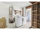 Laundry room includes washer, dryer, and water heater at 7139 Mountain Moss Dr, Las Vegas, NV 89147