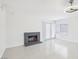 Spacious living room with tiled floors and a brick fireplace at 7139 Mountain Moss Dr, Las Vegas, NV 89147