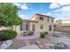 Backyard featuring a patio with dining table and basketball area, perfect for outdoor entertaining and recreation at 7183 Majestic Bluff Pl, Las Vegas, NV 89113