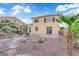 Well-maintained backyard with spacious patio, gravel landscaping, and space for outdoor activities at 7183 Majestic Bluff Pl, Las Vegas, NV 89113