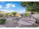 Spacious backyard features desert landscaping, a raised spa, and plenty of room for outdoor living at 7183 Majestic Bluff Pl, Las Vegas, NV 89113