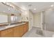Bright bathroom features a double vanity, shower, and modern fixtures at 7183 Majestic Bluff Pl, Las Vegas, NV 89113