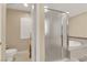Modern bathroom featuring a walk-in shower, standalone tub, and stylish fixtures at 7183 Majestic Bluff Pl, Las Vegas, NV 89113