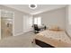 Bedroom featuring cozy carpet, a desk and bright windows at 7183 Majestic Bluff Pl, Las Vegas, NV 89113