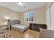 Well-lit bedroom with shuttered windows, hard wood floors, and a neutral color palette at 7183 Majestic Bluff Pl, Las Vegas, NV 89113
