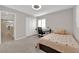 Bright bedroom with a neutral color palette, plush carpet, and a large closet at 7183 Majestic Bluff Pl, Las Vegas, NV 89113