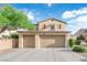Beautiful home exterior showcasing a spacious three-car garage and well-maintained landscaping at 7183 Majestic Bluff Pl, Las Vegas, NV 89113