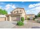 Attractive home featuring a three-car garage, desert landscaping, and a well-maintained front yard at 7183 Majestic Bluff Pl, Las Vegas, NV 89113
