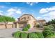 Charming home with a three-car garage, desert landscaping, and a well-manicured lawn at 7183 Majestic Bluff Pl, Las Vegas, NV 89113