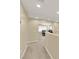 View of hallway with neutral paint, leading to a cozy office space with natural lighting at 7183 Majestic Bluff Pl, Las Vegas, NV 89113