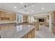 Well-equipped kitchen with stainless steel appliances, granite countertops, and an open layout for easy entertaining at 7183 Majestic Bluff Pl, Las Vegas, NV 89113