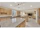 Bright kitchen features stainless steel appliances, granite countertops, and a view to an adjacent living area at 7183 Majestic Bluff Pl, Las Vegas, NV 89113