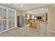 Bright eat-in kitchen with stainless steel appliances, wood cabinets, an island and tile floors at 7183 Majestic Bluff Pl, Las Vegas, NV 89113