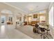 Bright and airy living room with elegant archways, neutral tones, and plush carpeting at 7183 Majestic Bluff Pl, Las Vegas, NV 89113