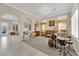 Bright living room featuring tile floors, neutral walls, and multiple archways at 7183 Majestic Bluff Pl, Las Vegas, NV 89113