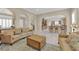 Open concept living room showcasing neutral paint, tile floors, and archways at 7183 Majestic Bluff Pl, Las Vegas, NV 89113
