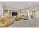 Spacious living room featuring neutral paint, shutters, and archways at 7183 Majestic Bluff Pl, Las Vegas, NV 89113