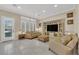 Spacious living room featuring neutral paint, shutters, and tile floors at 7183 Majestic Bluff Pl, Las Vegas, NV 89113