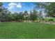 Well-maintained community park showcasing lush green grass and mature trees for outdoor recreation at 7183 Majestic Bluff Pl, Las Vegas, NV 89113