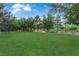 Well-maintained park featuring lush green lawns, mature trees, and walking paths for outdoor enjoyment at 7183 Majestic Bluff Pl, Las Vegas, NV 89113