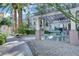Community barbeque and picnic area with a covered pergola at 7189 S Durango Dr # 208, Las Vegas, NV 89113