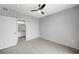 Bedroom with wood-style tile floors, neutral paint, and an ensuite bathroom at 7189 S Durango Dr # 208, Las Vegas, NV 89113