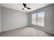 Bedroom with large window, ceiling fan, and wood-style tile floors at 7189 S Durango Dr # 208, Las Vegas, NV 89113