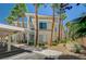 Exterior of building featuring multiple stories, windows, and palm trees at 7189 S Durango Dr # 208, Las Vegas, NV 89113