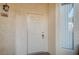 Apartment entry featuring door number 208, lockbox and stucco wall at 7189 S Durango Dr # 208, Las Vegas, NV 89113