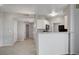 Kitchen featuring an open bar to the living room, white cabinetry and tile floors for a modern look at 7189 S Durango Dr # 208, Las Vegas, NV 89113