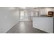 Spacious living room with neutral colors, tile floors, and bar seating to the kitchen, creating a great flow at 7189 S Durango Dr # 208, Las Vegas, NV 89113