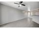 Minimalist living room with tile floors, neutral paint, and lots of space for furniture and decor at 7189 S Durango Dr # 208, Las Vegas, NV 89113
