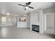 Open-concept living room showcasing tile floors, a cozy fireplace, and neutral paint, creating a welcoming space at 7189 S Durango Dr # 208, Las Vegas, NV 89113