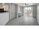 Bright living room featuring modern tile floors, fireplace, and sliding glass doors to the outdoor patio at 7189 S Durango Dr # 208, Las Vegas, NV 89113