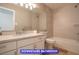Downstairs bathroom featuring a sleek vanity, modern fixtures, and updated tiling at 7365 Mission Hills Dr, Las Vegas, NV 89113