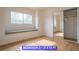 Bedroom featuring natural light and a large closet with mirrored doors at 7365 Mission Hills Dr, Las Vegas, NV 89113