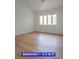 Spacious bedroom with a large window that allows natural light to flood the room at 7365 Mission Hills Dr, Las Vegas, NV 89113