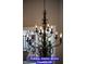 A dining room chandelier is a branched lighting fixture designed to illuminate a room at 7365 Mission Hills Dr, Las Vegas, NV 89113