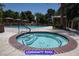Community pool area with both a large pool and a smaller hot tub, surrounded by cabanas at 7365 Mission Hills Dr, Las Vegas, NV 89113