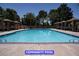 Inviting community pool with cabanas and lounge chairs for relaxation at 7365 Mission Hills Dr, Las Vegas, NV 89113