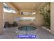 Community spa area with a hot tub, seating, and privacy wall at 7365 Mission Hills Dr, Las Vegas, NV 89113