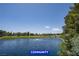 Scenic view of the community lake and beautiful landscaping providing a serene environment at 7365 Mission Hills Dr, Las Vegas, NV 89113