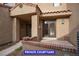 Cozy front courtyard providing a private entrance, with brick accents, perfect for relaxing and entertaining at 7365 Mission Hills Dr, Las Vegas, NV 89113