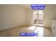 Bright den featuring tile floors and a courtyard view through glass doors at 7365 Mission Hills Dr, Las Vegas, NV 89113