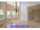 Dining room featuring a chandelier, and abundant natural light from large windows at 7365 Mission Hills Dr, Las Vegas, NV 89113